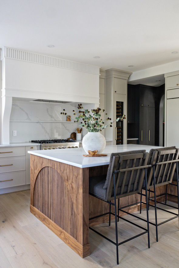 a restaurant with green chairs and white tables