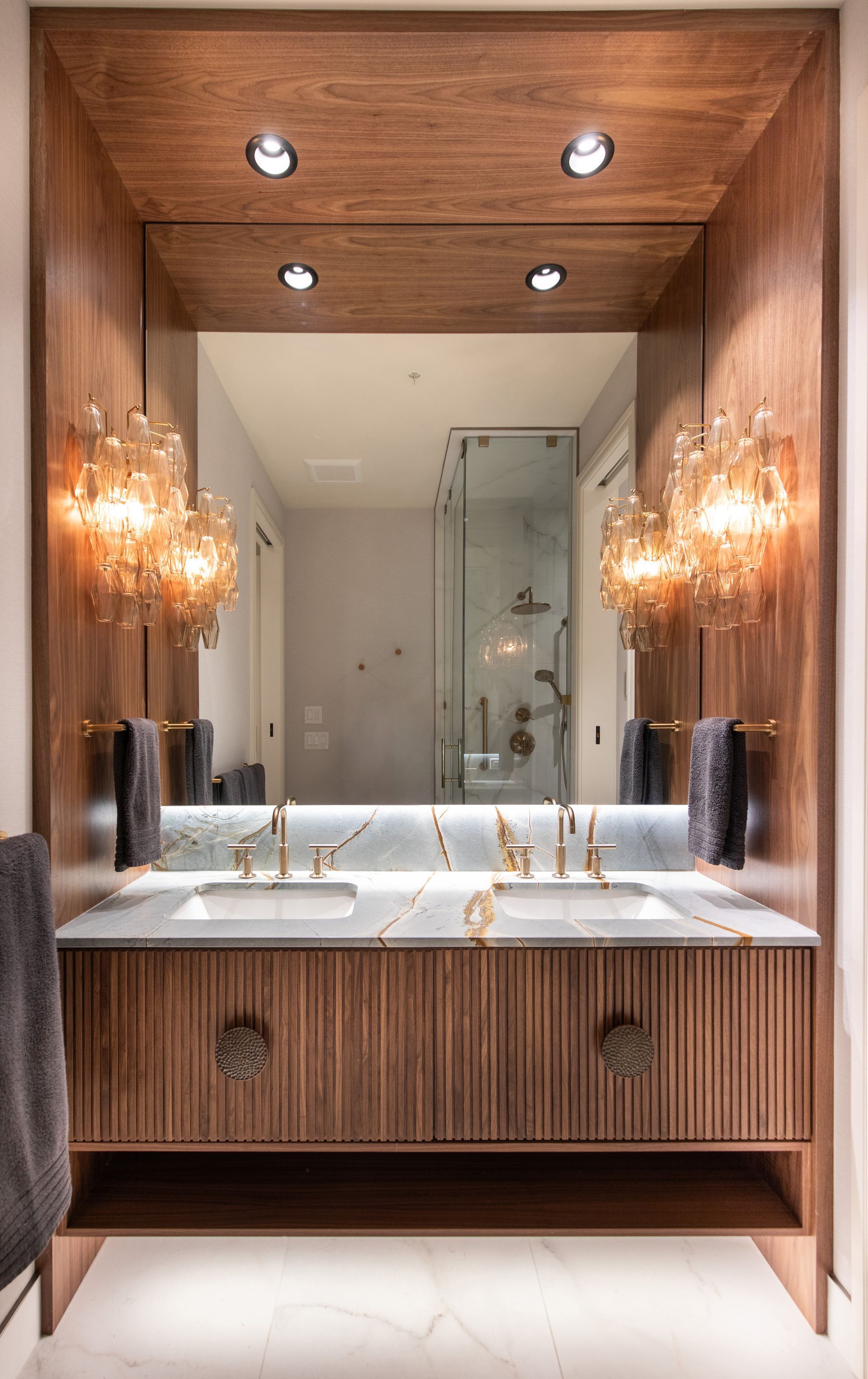 a large white house with a lot of windows and a fence in front of it .