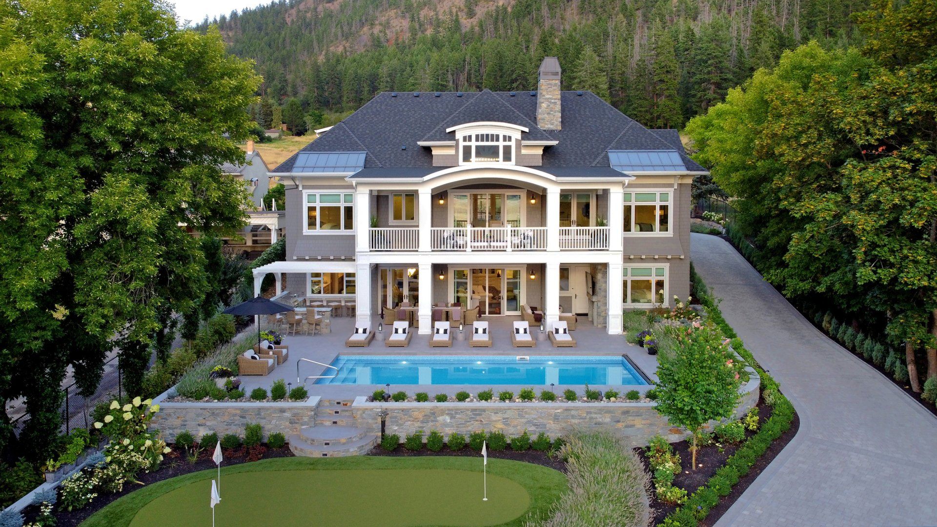 an aerial view of a large house with a swimming pool