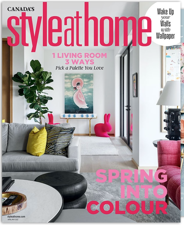a living room with a couch and a table on the cover of a magazine .