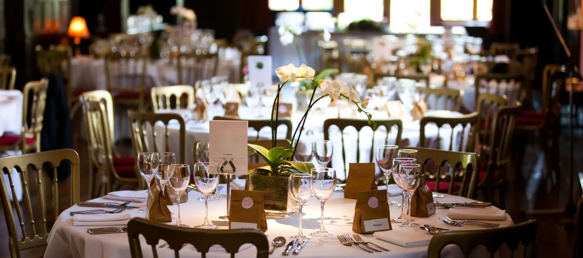 A restaurant with tables and chairs set up for a banquet.