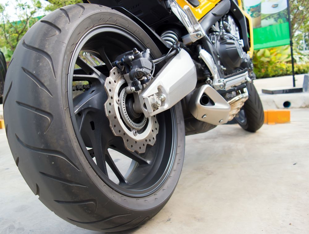 A Close Up Of The Back Wheel Of A Motorcycle — NCM Towing Newcastle In Broadmeadow, NSW