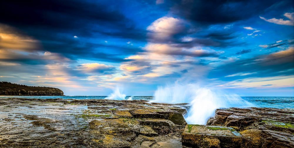 The Waves are Crashing Against the Rocks on the Beach — Coastal Vibez In The Entrance, NSW