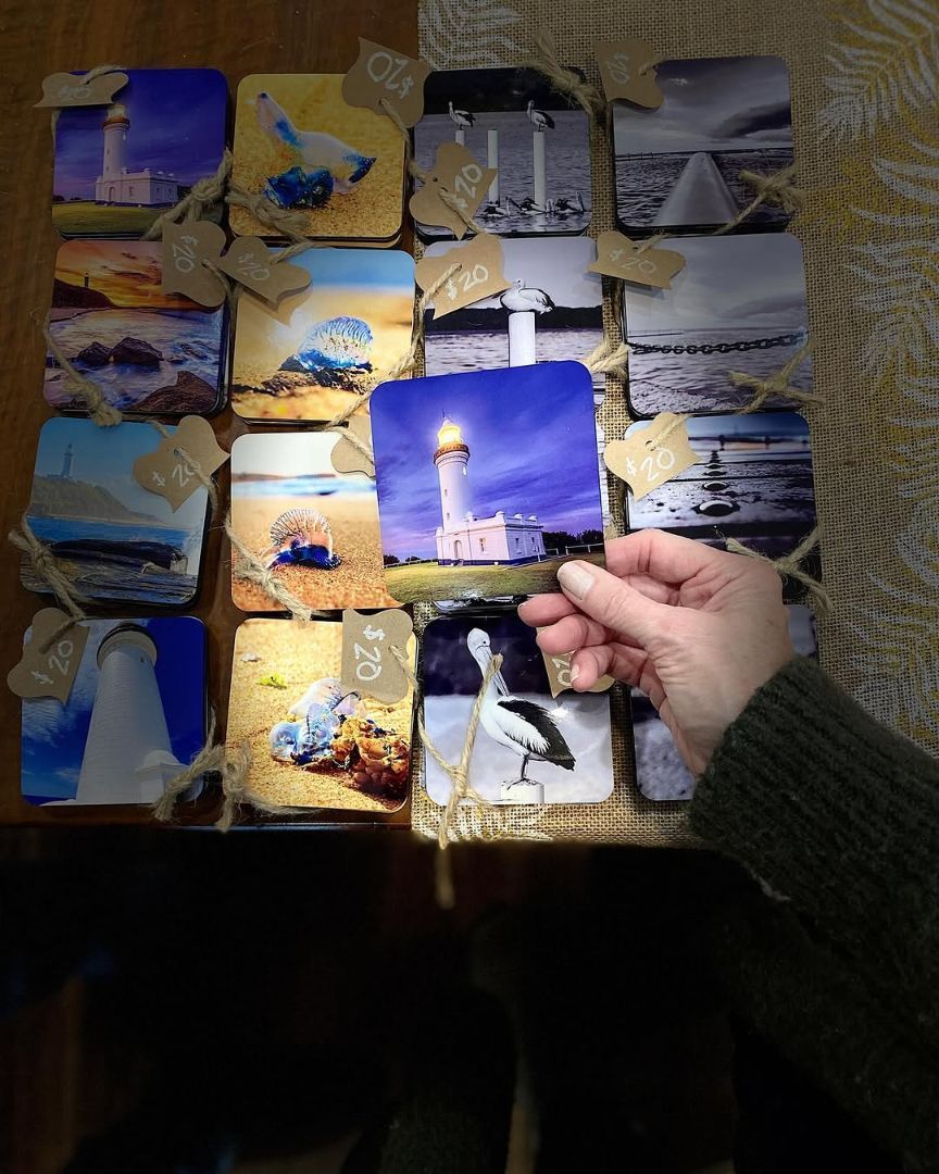 A Person is Holding a Picture of a Lighthouse in Their Hand — Coastal Vibez In The Entrance, NSW