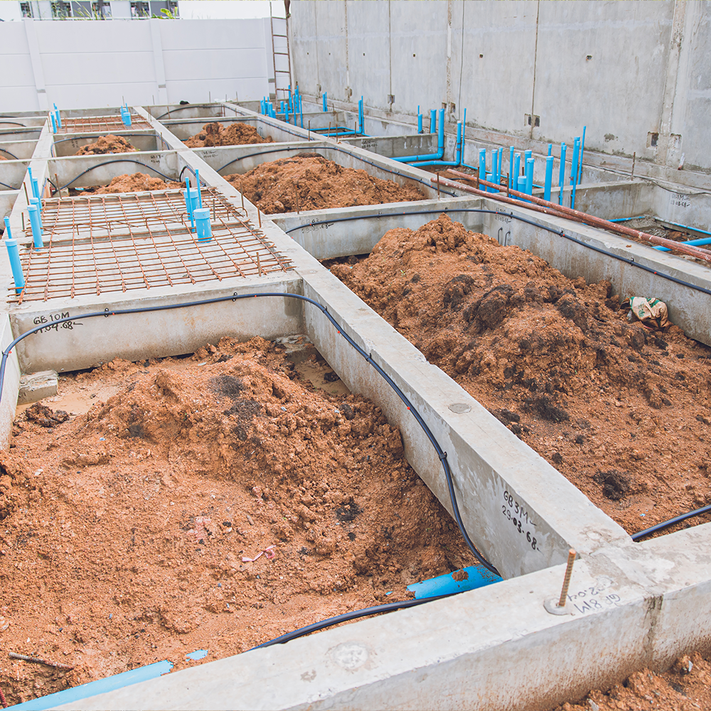 A concrete driveway with a texan logo on it