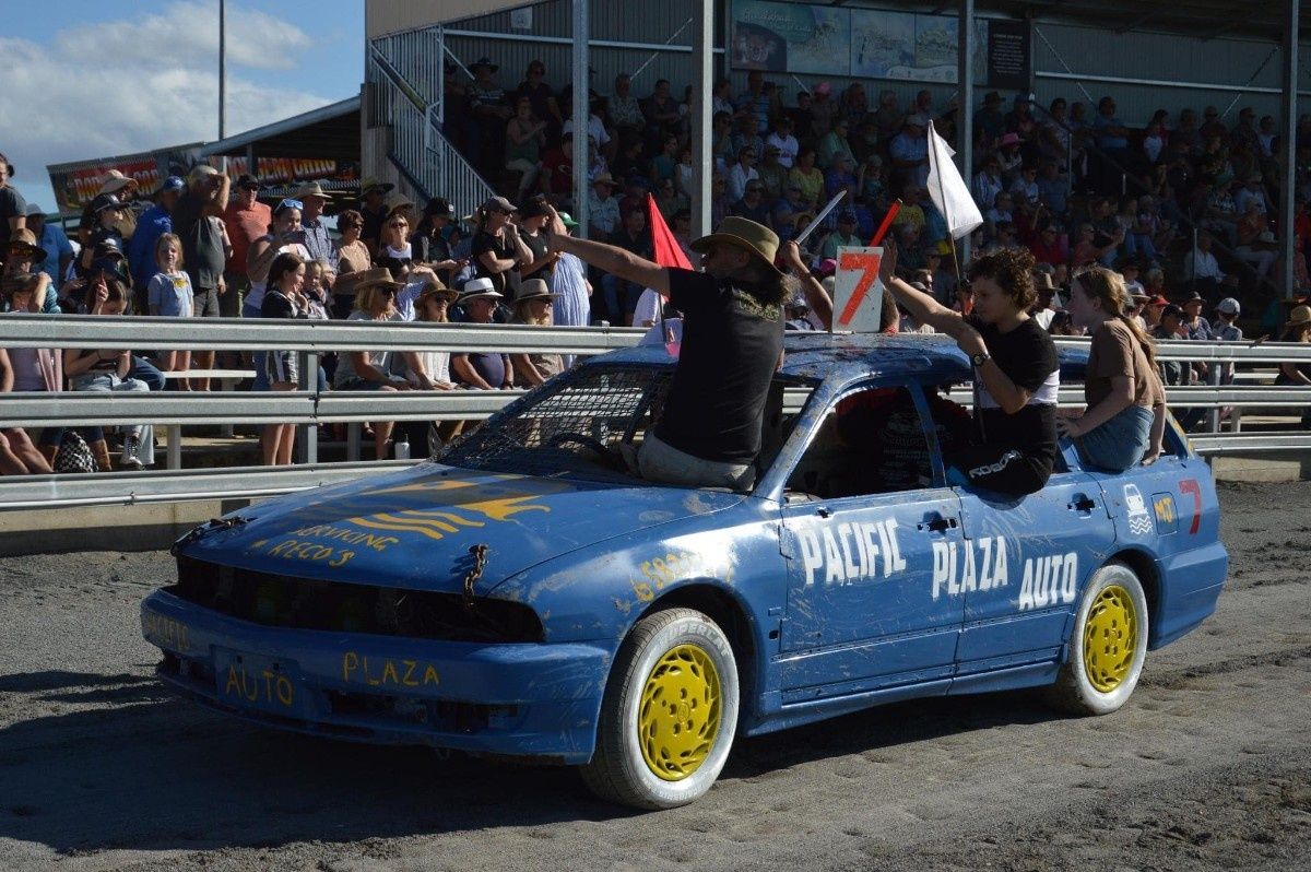 A group of people are sitting in a blue car — Pacific Plaza Automotive in Port Macquarie, NSW