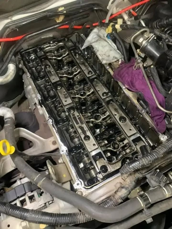 A Close up Of a Car Engine with A Purple Cloth on Top of It — Pacific Plaza Automotive in Port Macquarie, NSW