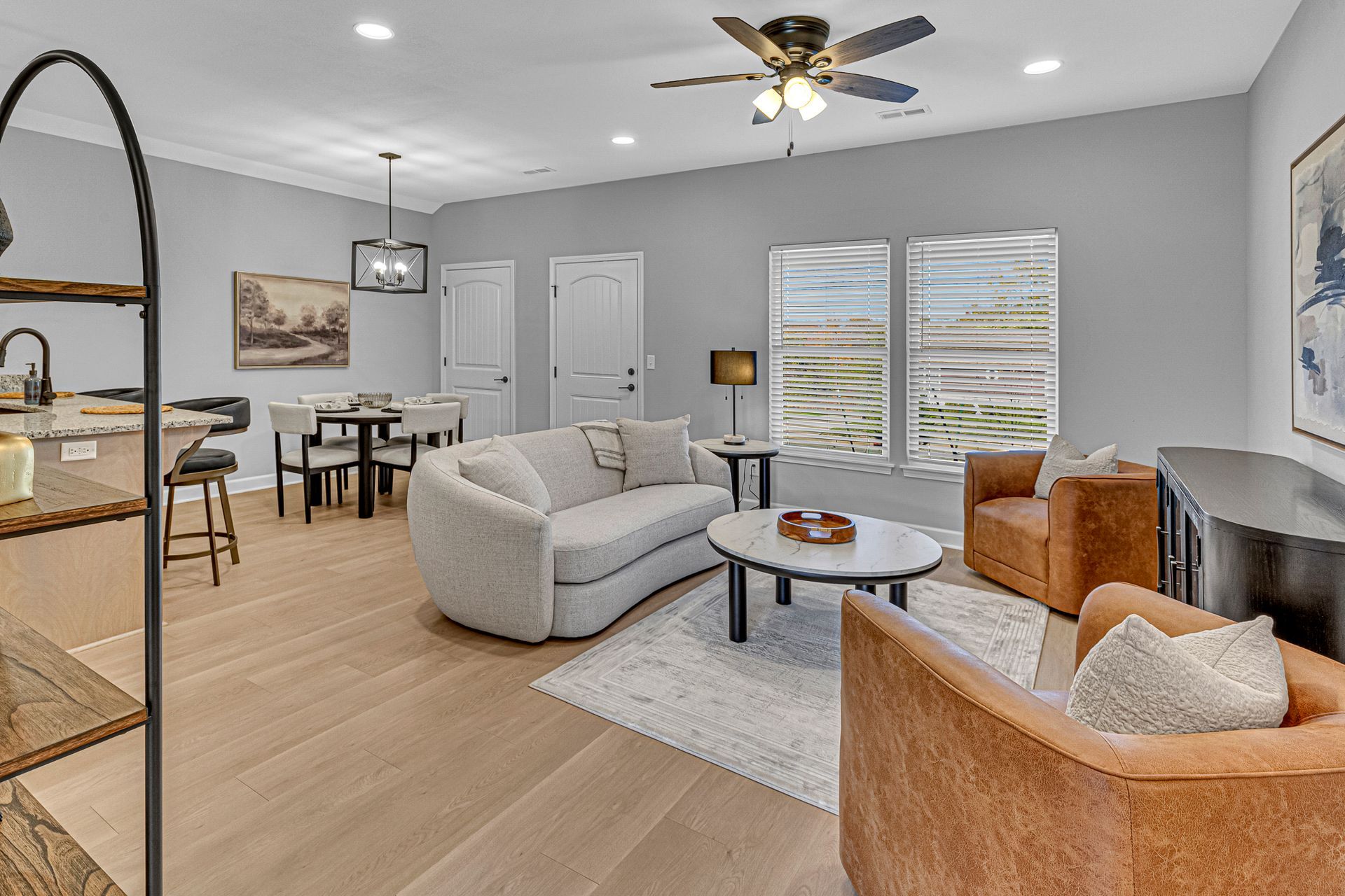 Photo of cottages living room, featuring a couch and 2 chairs