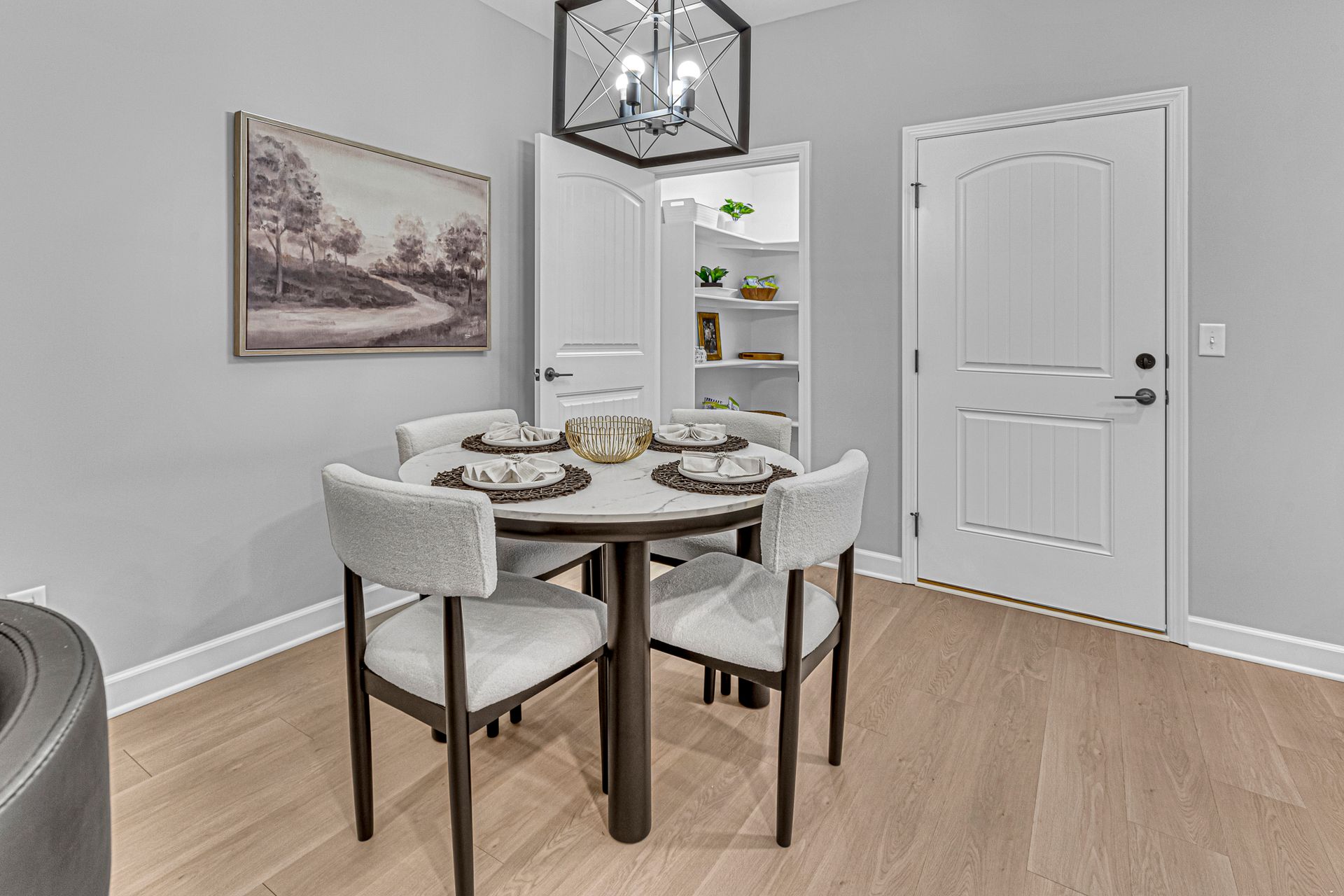 Dinning area, showing a table set for dinner with 4 chairs