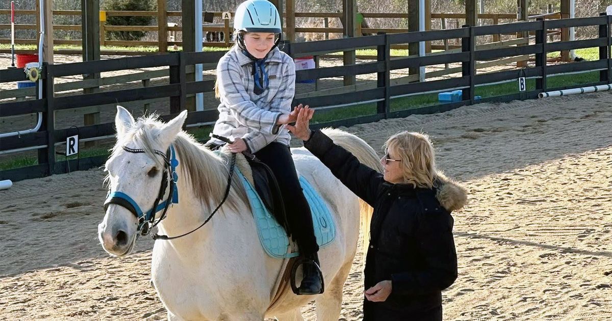 wendy and a sudent riding.