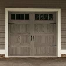A Garage Door with A Window on The Side of A House - Rochester Hills, MI - J & B Doors