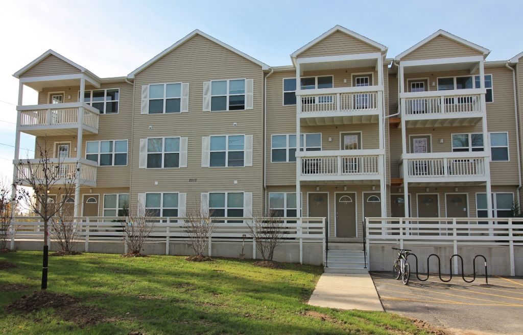 A large apartment building with lots of windows and balconies