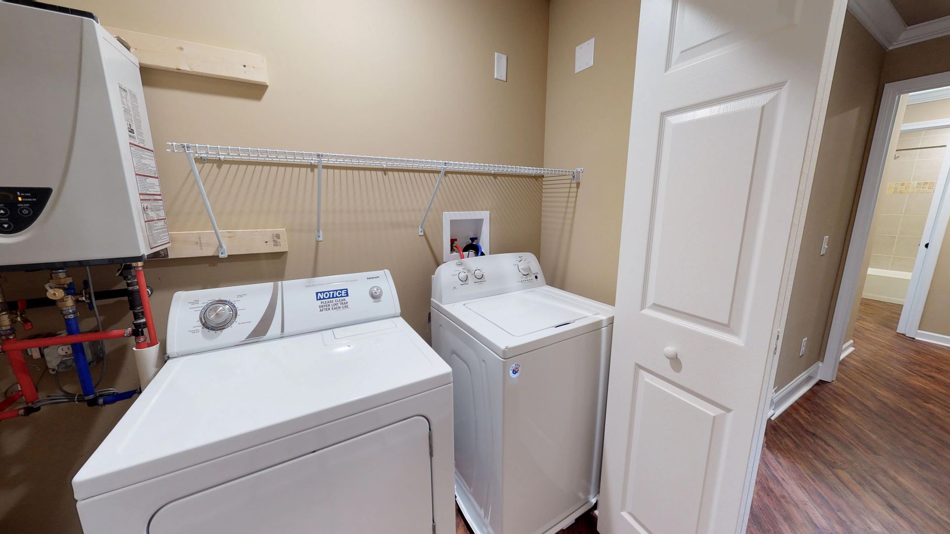 A laundry room with a washer and dryer in it.