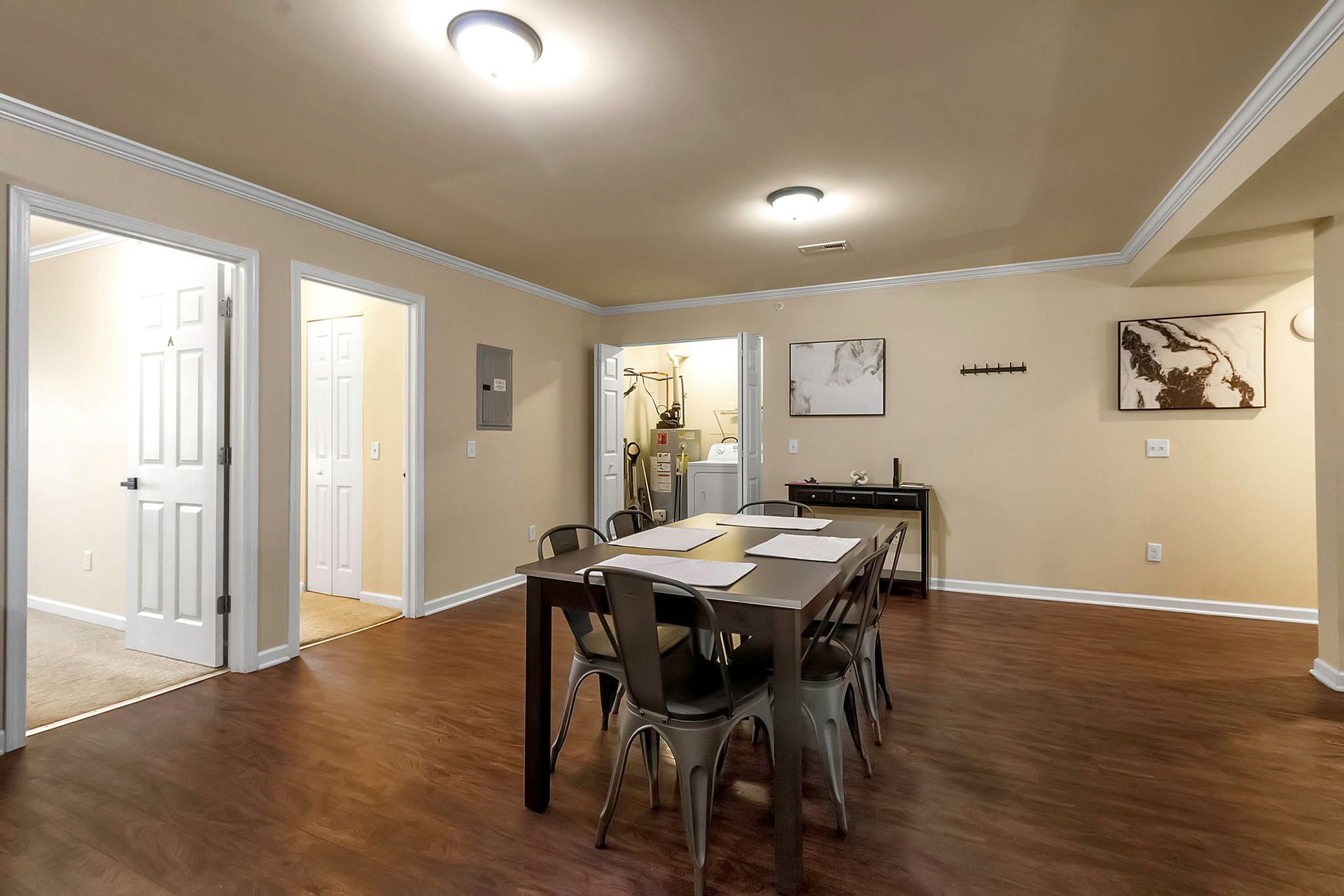 A large room with a dining table and chairs in it.