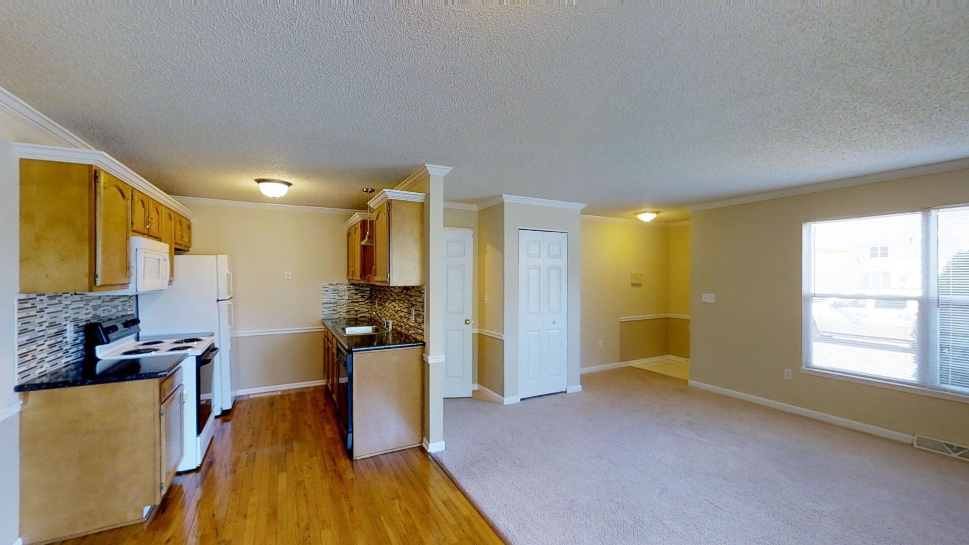 There is a kitchen and a living room in this house.