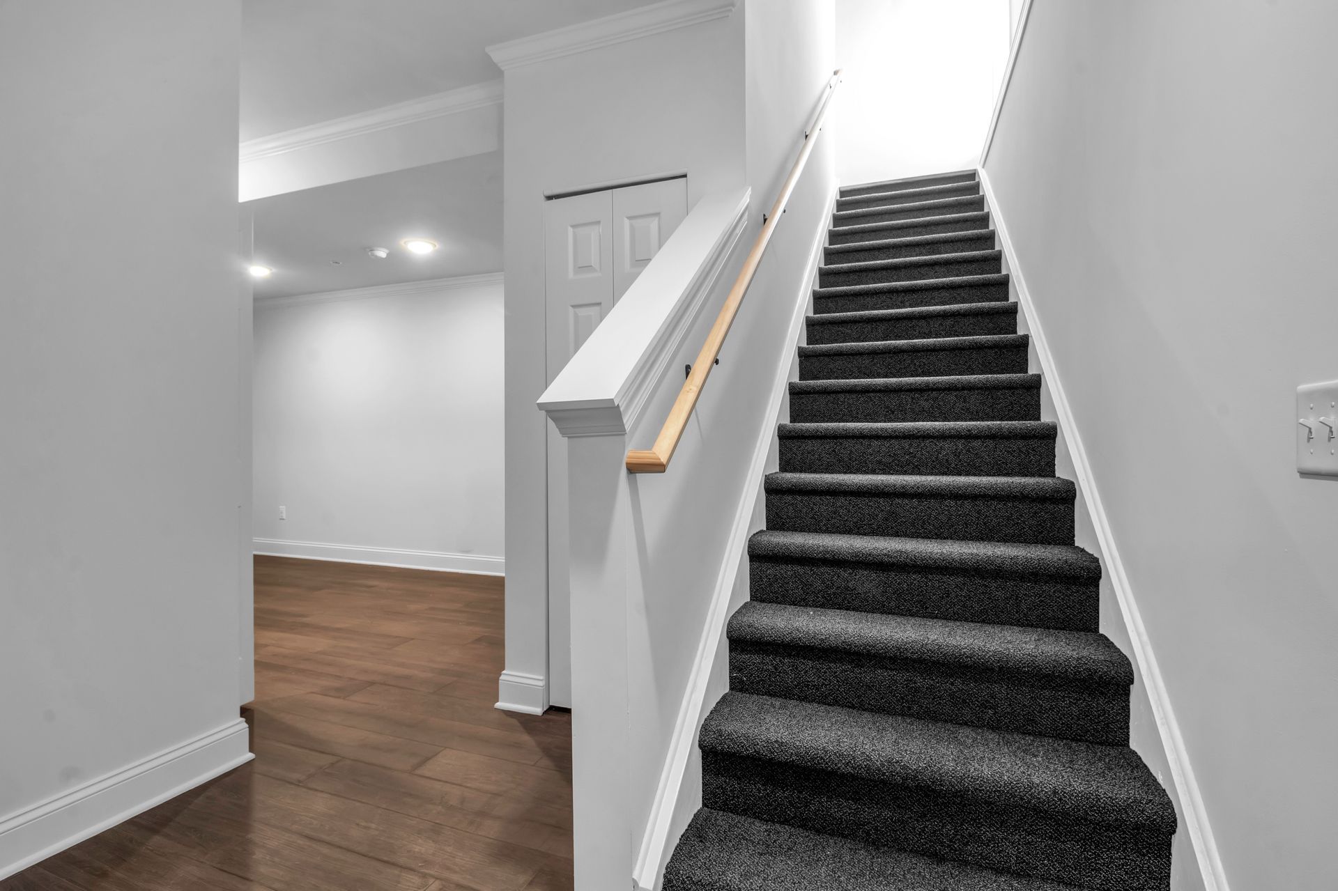 A set of stairs leading up to a basement in a house.
