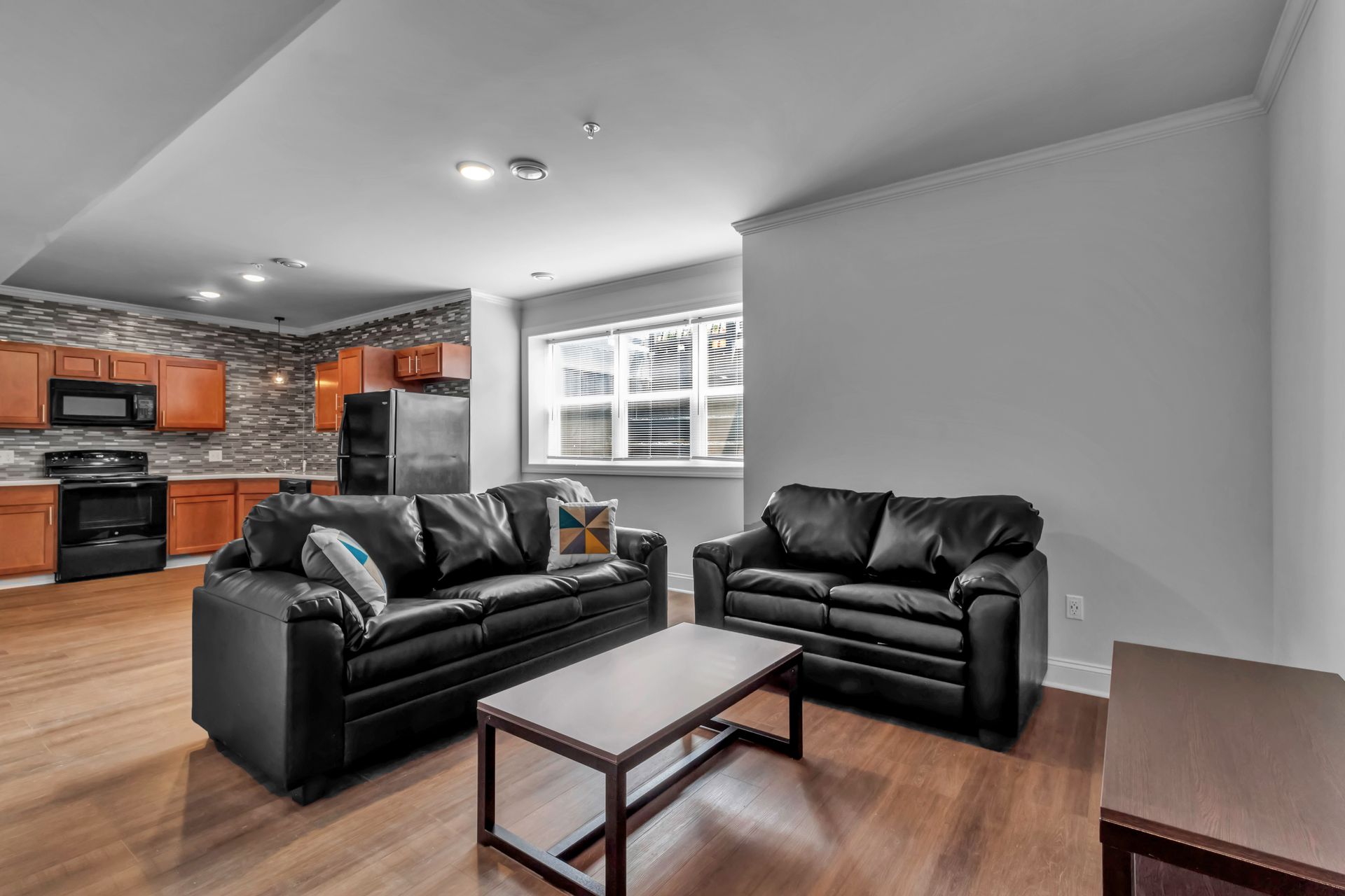 A living room with two couches and a coffee table.