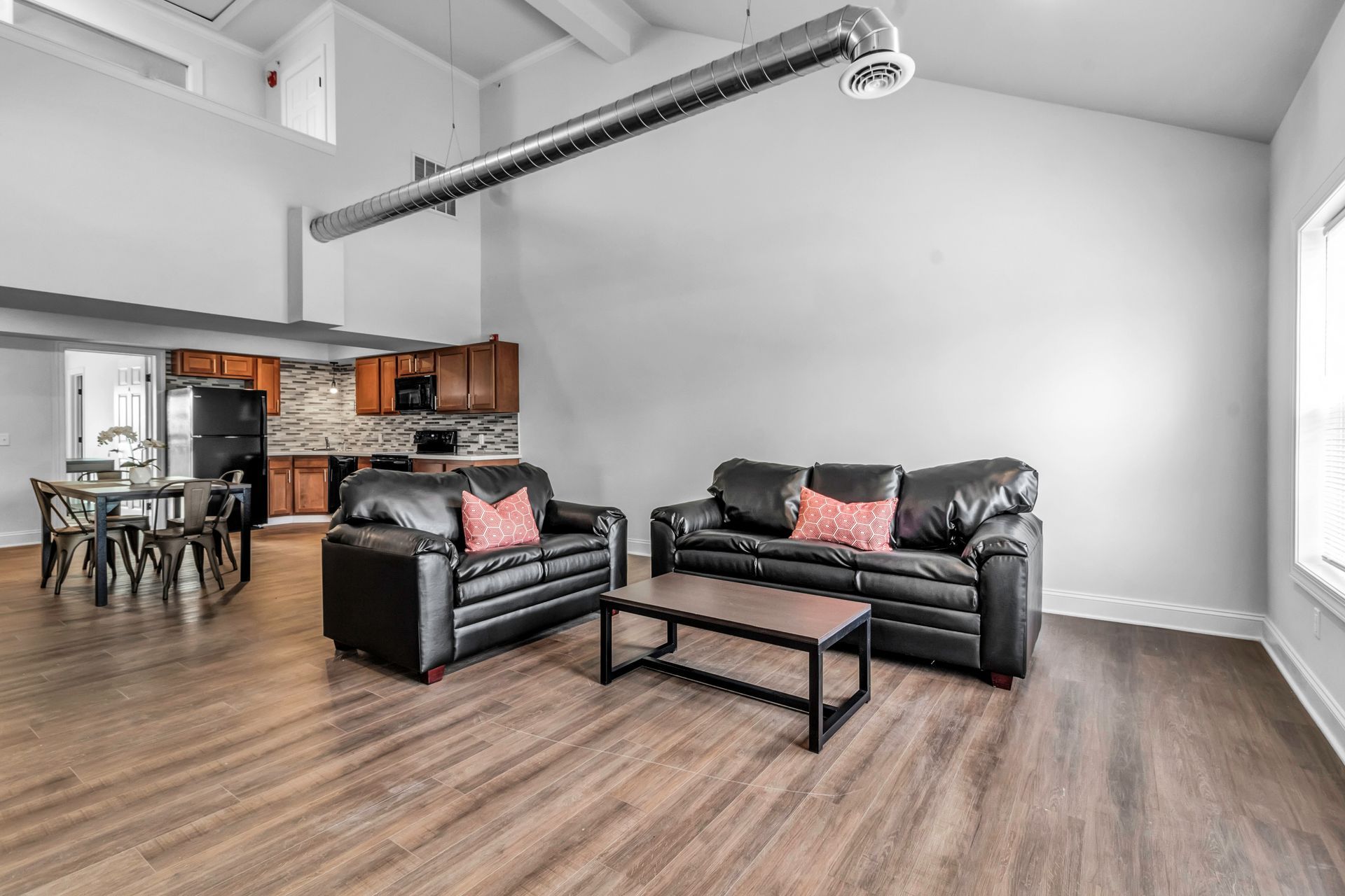 A living room with two couches and a coffee table.