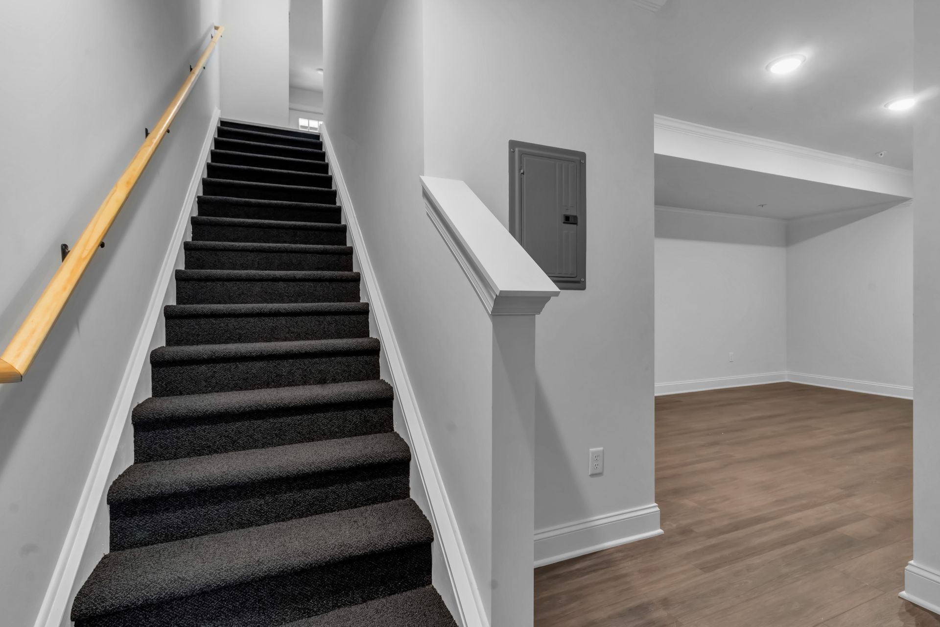 A set of stairs leading up to a basement in a house.