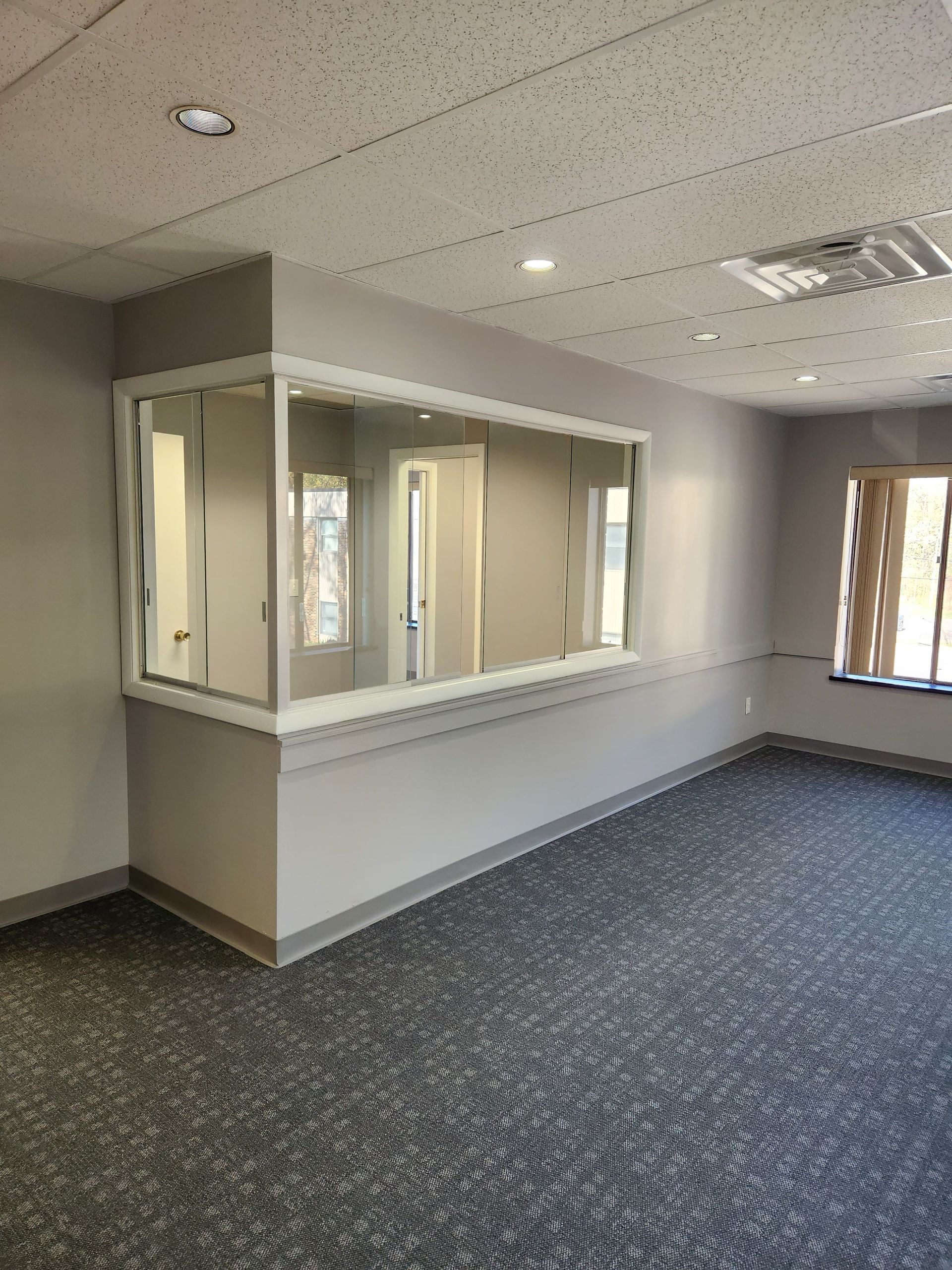 There is a large window in the middle of the room.