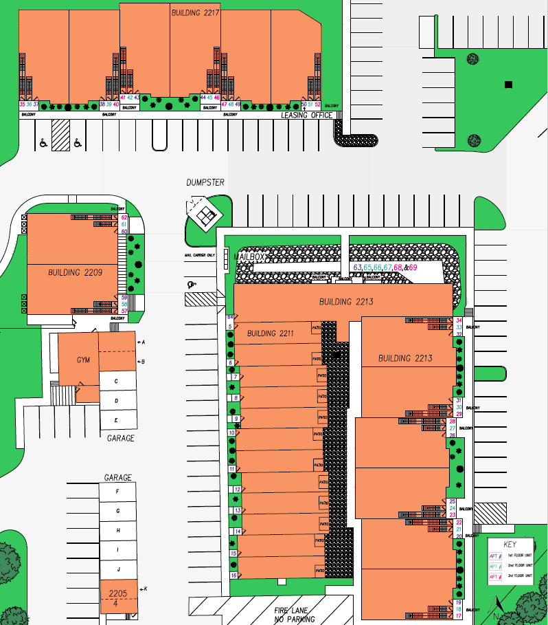 An aerial view of a building with a lot of parking spaces