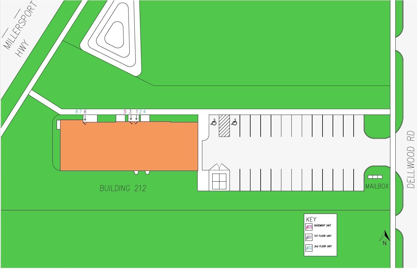 An aerial view of a parking lot with a building in the middle.