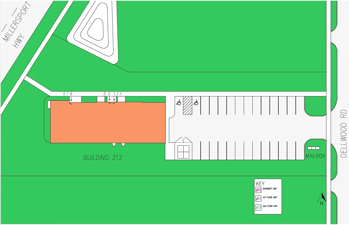 An aerial view of a parking lot with a large orange building in the middle.