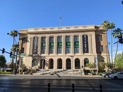 A large building with a sign on the side that says ' the new york '