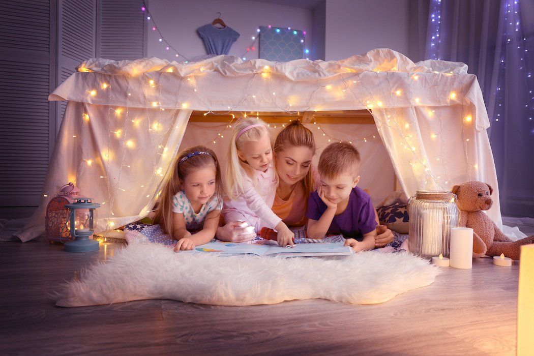 Family reading in a blanket fort during social distancing | Zone28 Pittsburgh