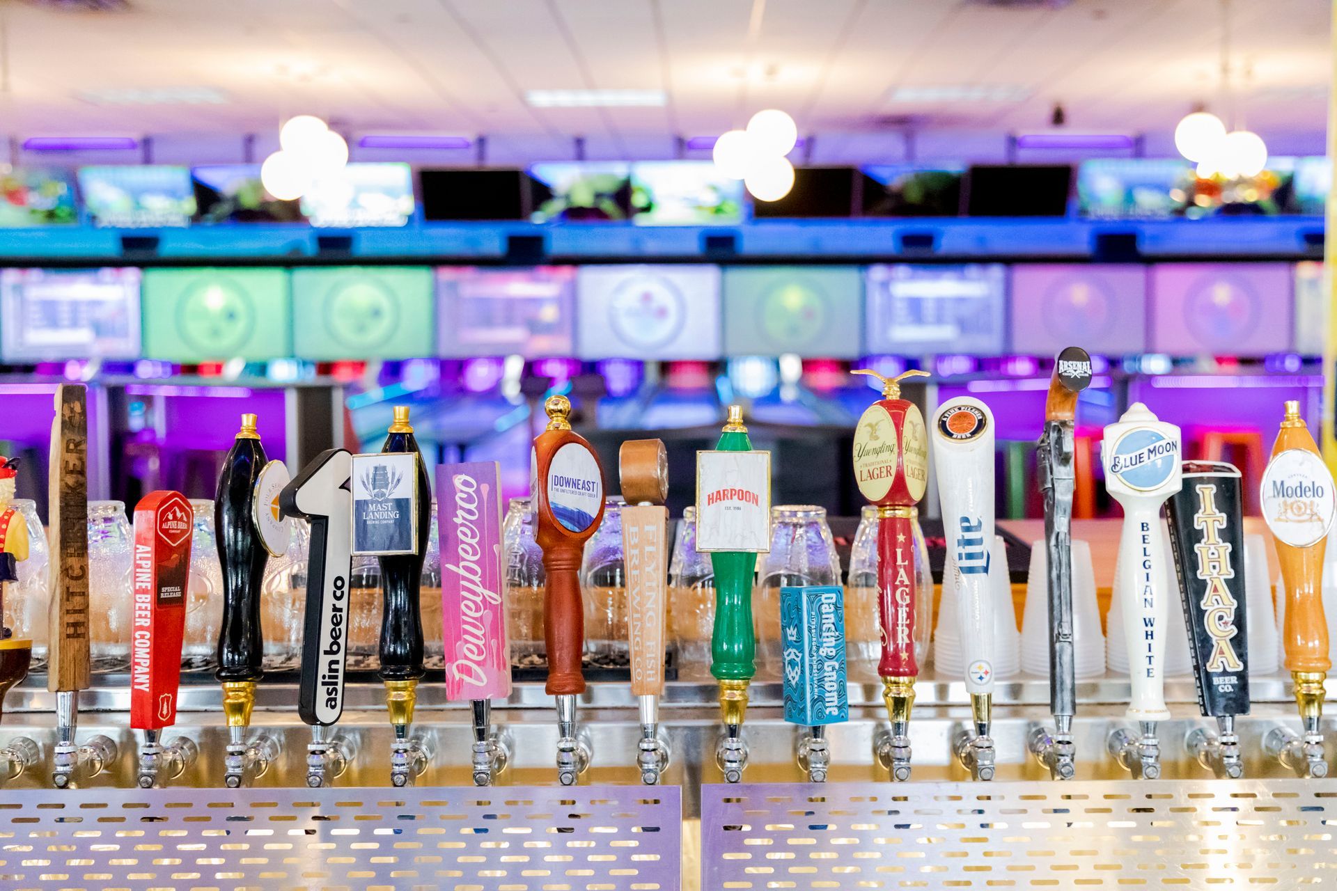 Endzone Sports Bar in Pittsburgh, PA featuring over 100 beers, 20 rotating drafts, large-screen TVs for sports viewing, and a lively atmosphere inside Zone 28 entertainment center.