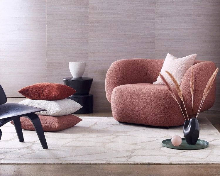 A Living Room With A Chair And Pillows On The Floor — Caba's Drapery In Coffs Harbour, NSW