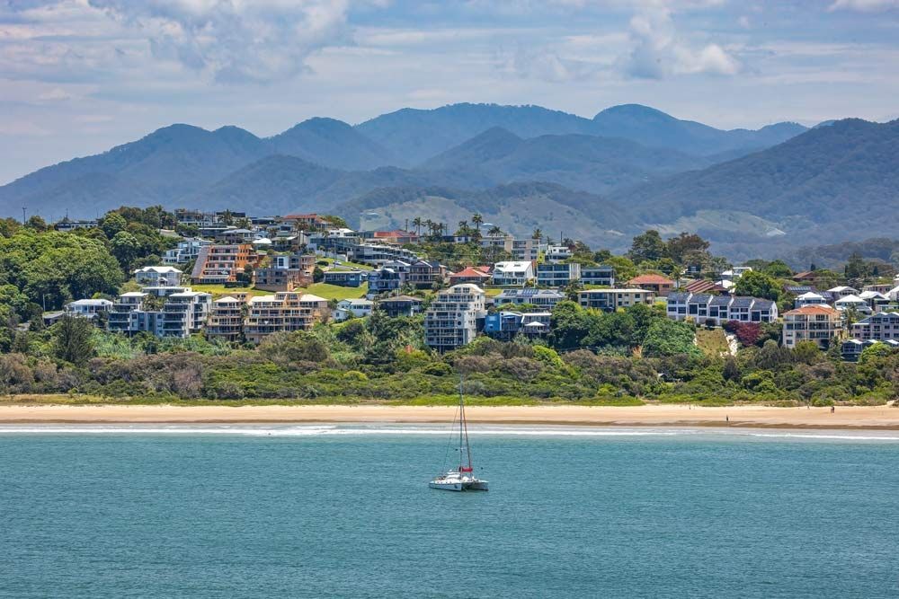 A Sailboat Is Floating On Top Of A Body Of Water — Caba's Drapery In Coffs Harbour, NSW