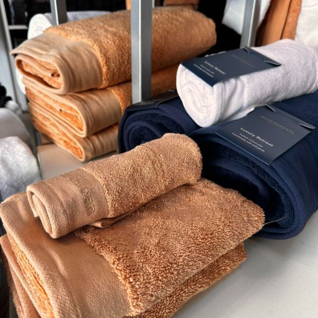 A Bunch Of Towels Are Stacked On Top Of Each Other — Caba's Drapery In Coffs Harbour, NSW