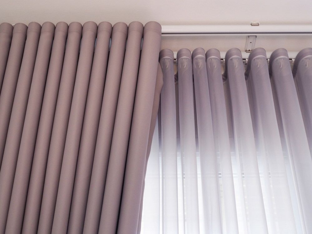 A Close Up Of A Pair Of Purple Curtains On A Window — Caba's Drapery In Coffs Harbour, NSW