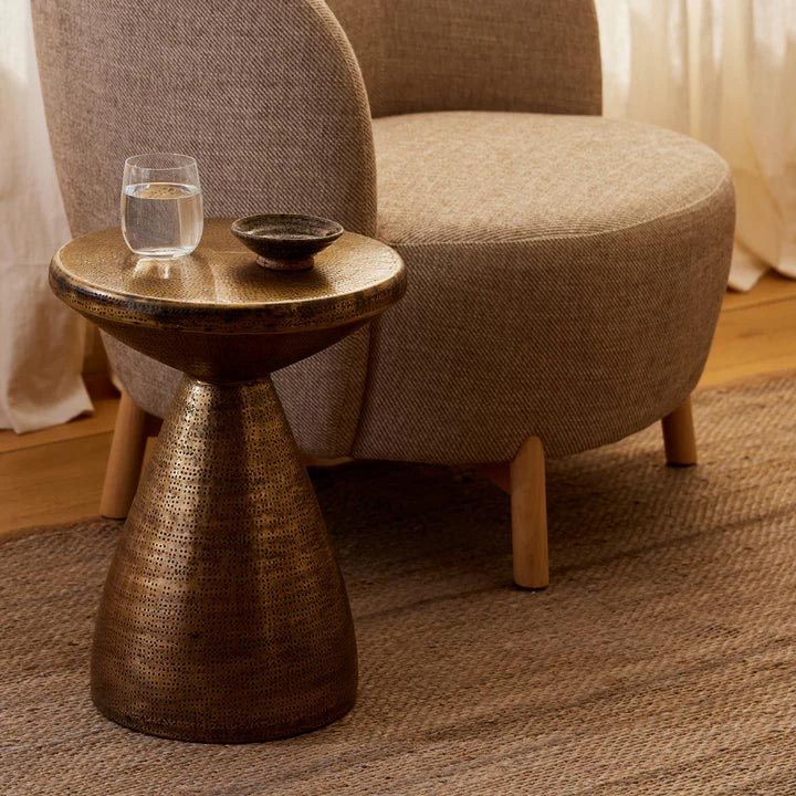 A Chair Sits Next To A Small Table With A Glass Of Water On It — Caba's Drapery In Coffs Harbour, NSW