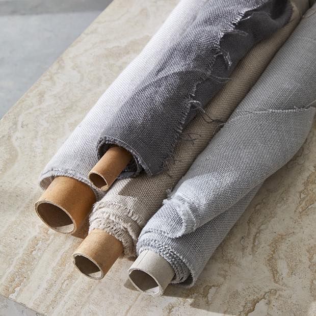 Three Rolls Of Fabric Are Stacked On Top Of Each Other — Caba's Drapery In Coffs Harbour, NSW