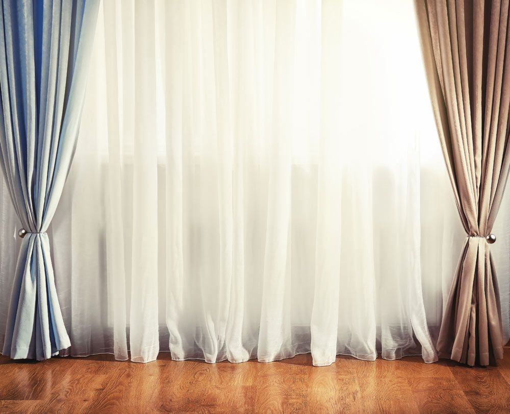 A Room With Two Curtains And A Wooden Floor — Caba's Drapery In Coffs Harbour, NSW