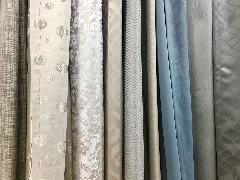 A Row Of Curtains Hanging On A Wall In A Store — Caba's Drapery In Coffs Harbour, NSW