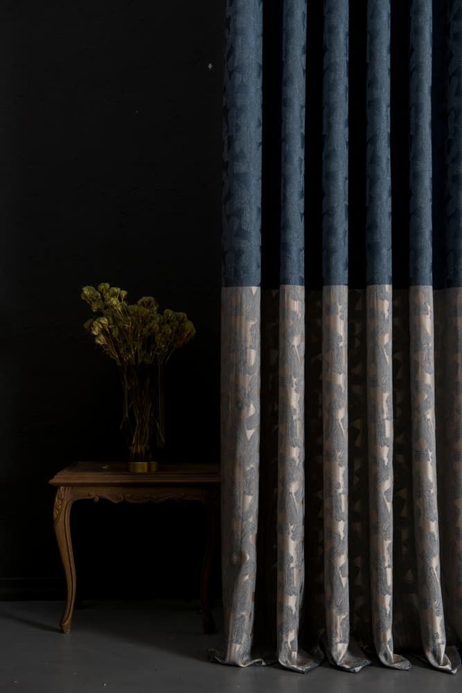 A Vase Of Flowers Is Sitting On A Table Next To A Pair Of Curtains — Caba's Drapery In Coffs Harbour, NSW