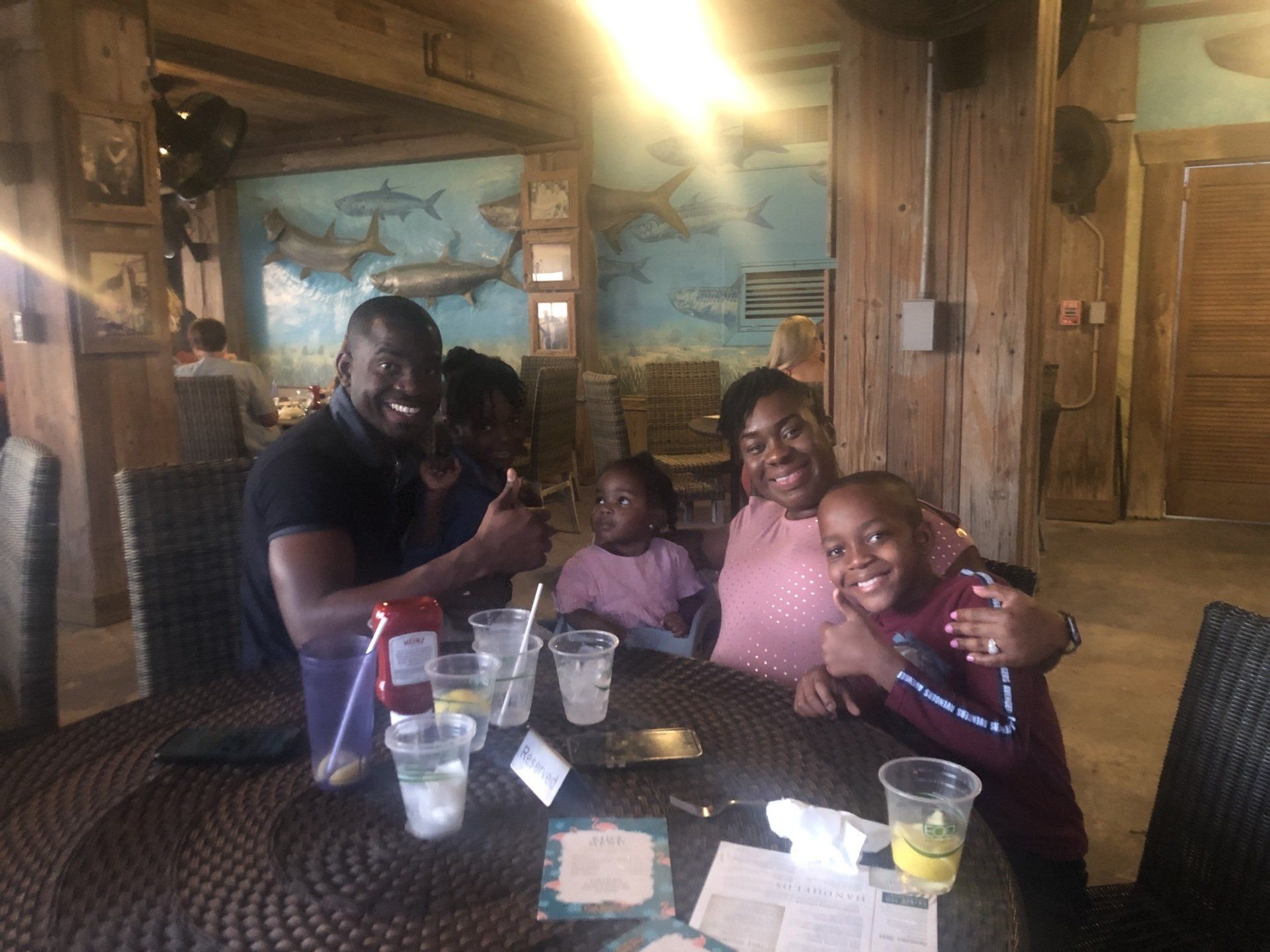 A family is sitting at a table in a restaurant.