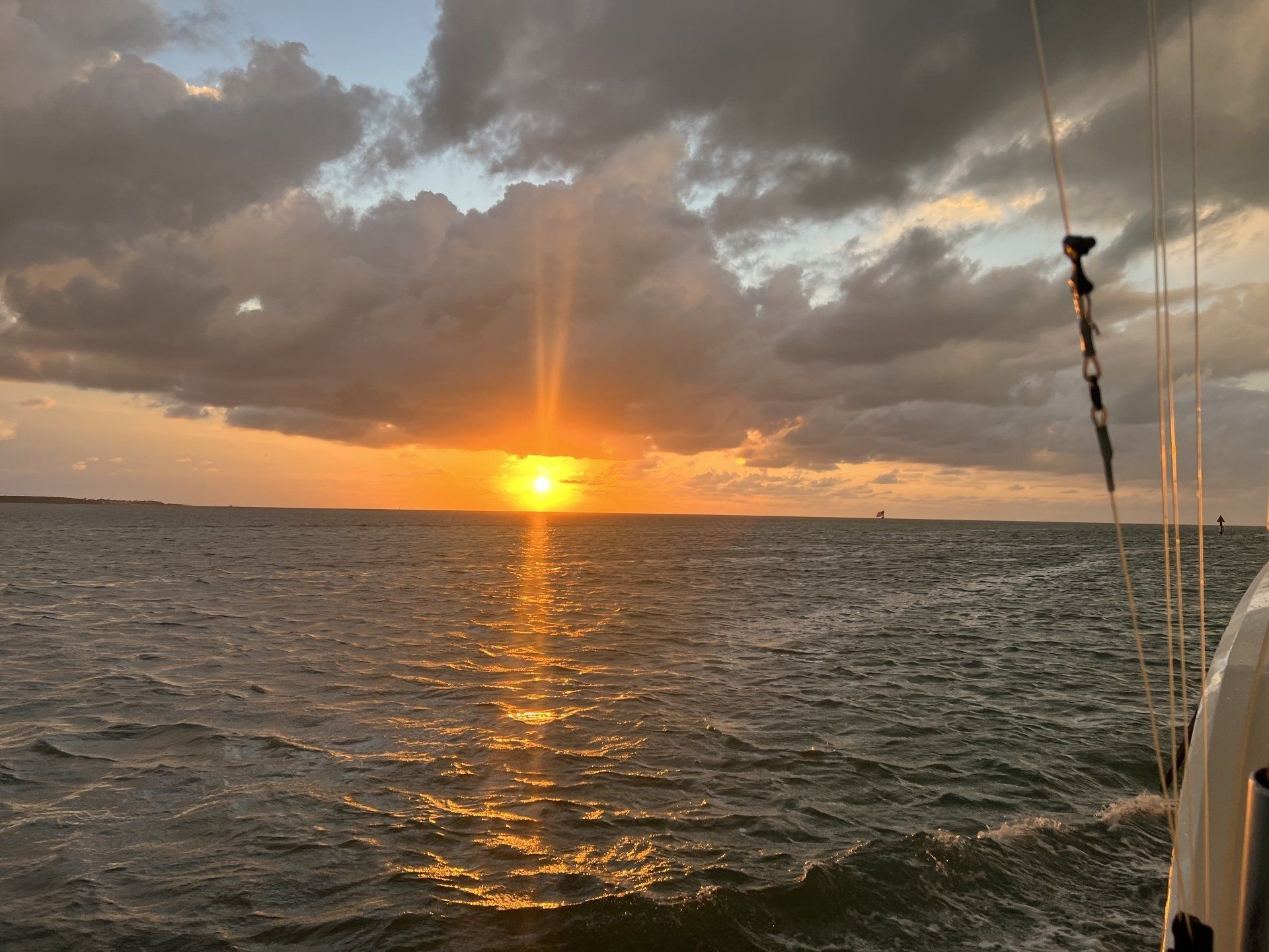 The sun is setting over the ocean.