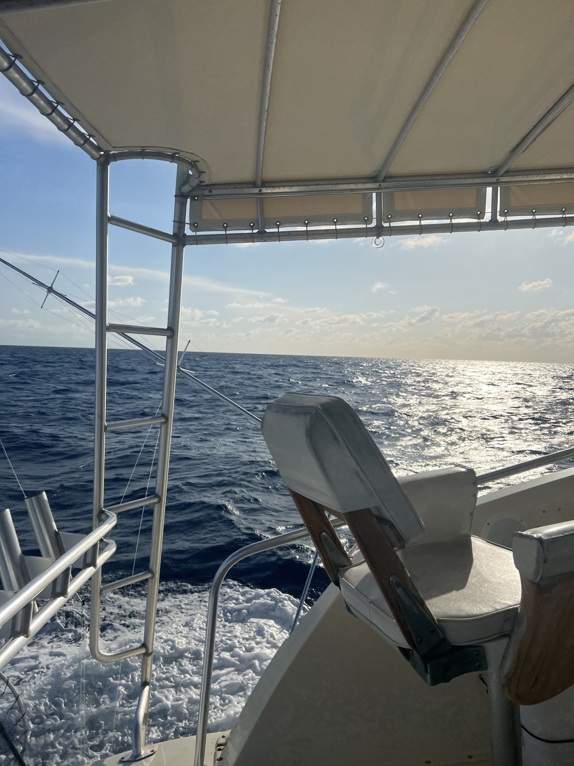 A boat is floating on top of a large body of water