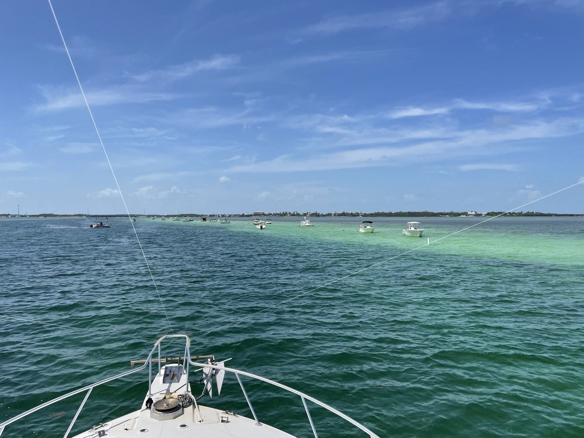 A boat is floating on top of a large body of water.