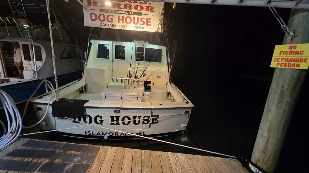 A boat is docked at the dog house harbor