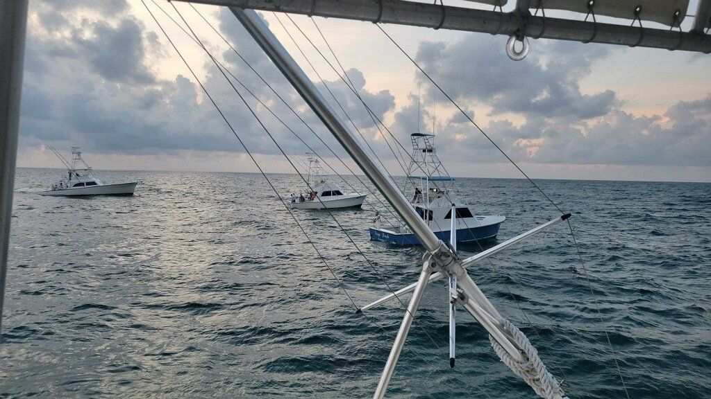 A boat is floating on top of a body of water.