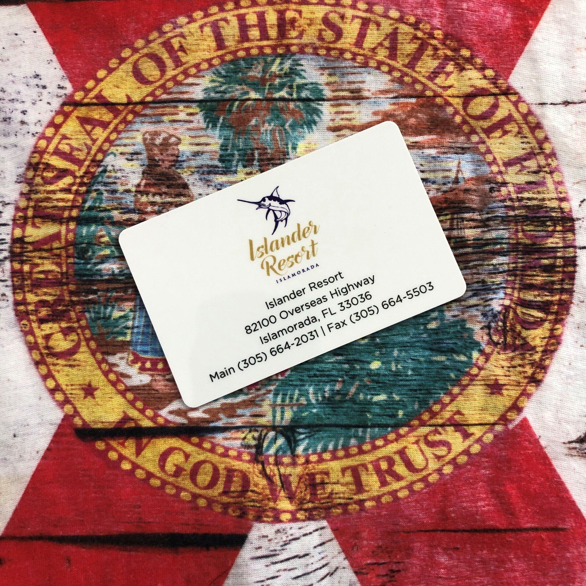 A white card with islander resort written on it