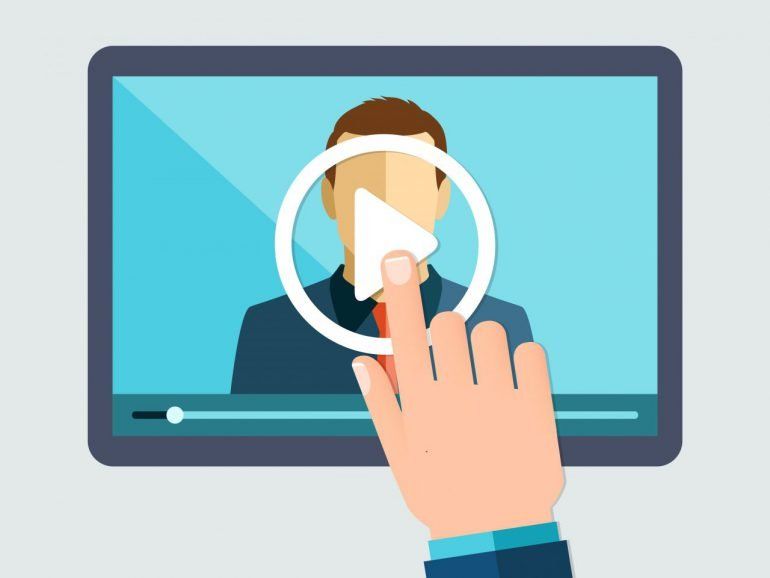 A hand is playing a video on a tablet.