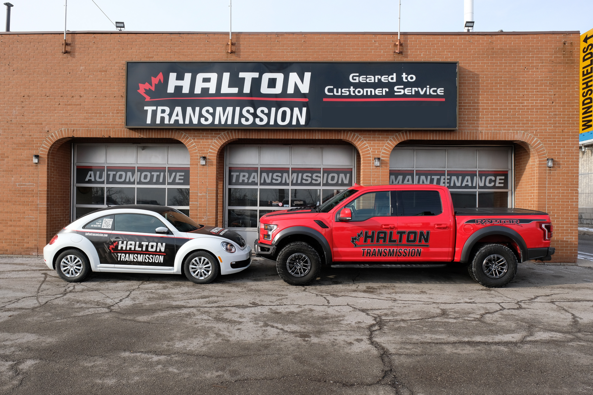 A Red Truck and a Branded Volkswagen | Halton Auto Service & Transmission
