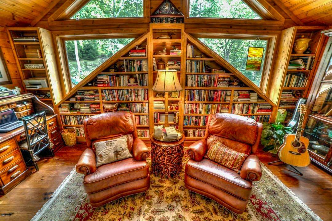 A living room filled with furniture and a guitar.