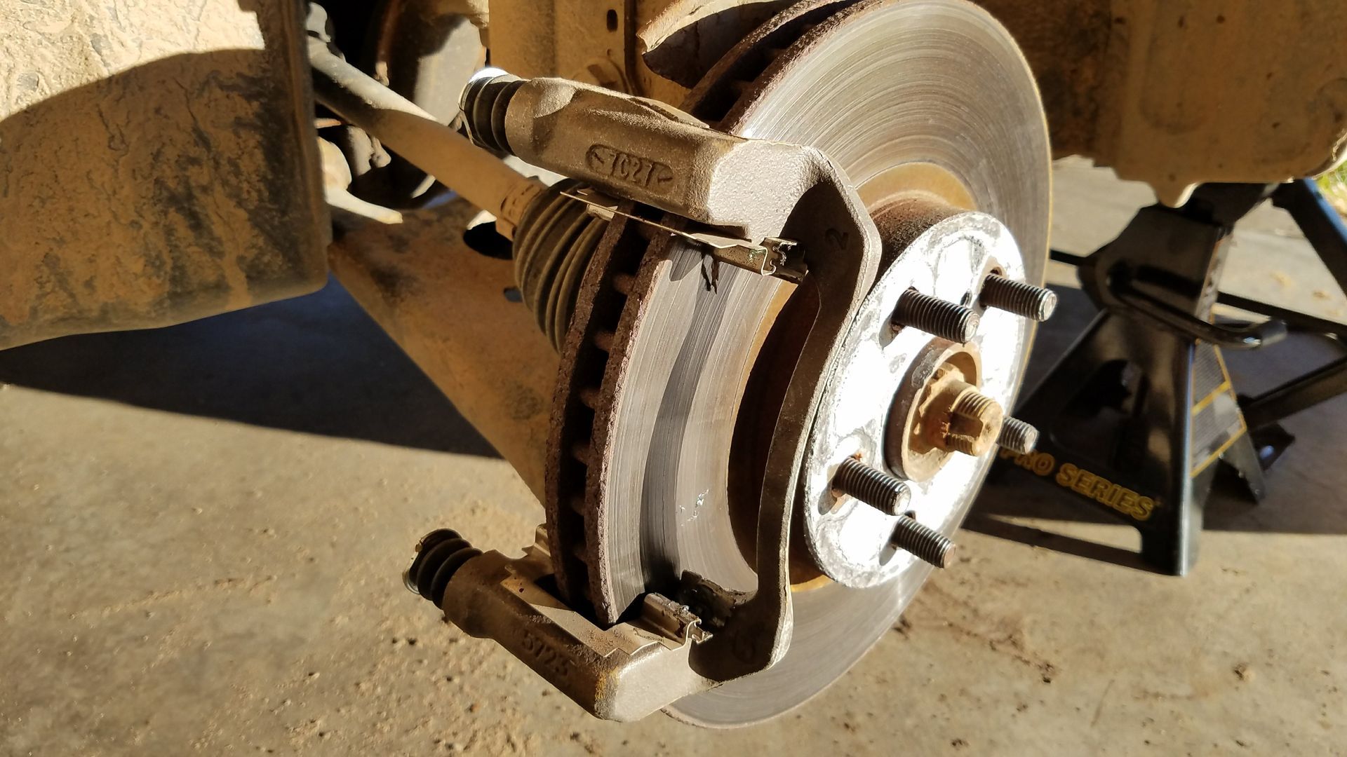 Big 10 Tire Pros Technician doing a Brake Pad Replacement in Clinton, MS